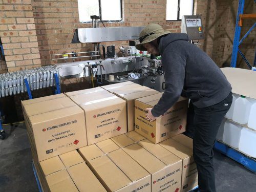 Packing Ethanol Fireplace Fuel into Boxes
